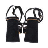 Black suede heeled sandals with ankle straps and block heels