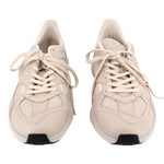 Pair of beige mesh sneakers showing the lace-up fronts and rounded toes