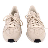 Pair of beige mesh sneakers showing the lace-up fronts and rounded toes