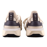 Pair of sneakers viewed from the heel, with dark heel panels and pull tabs