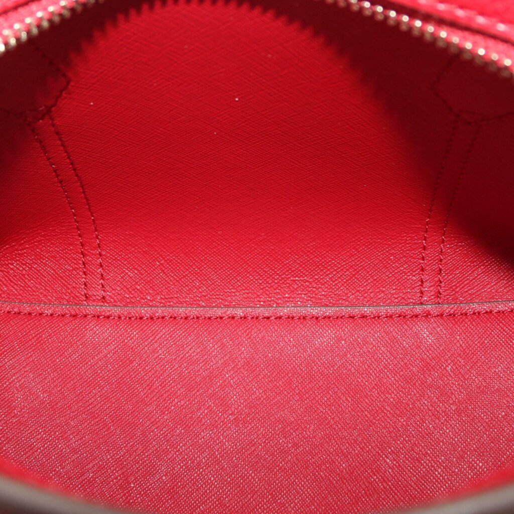 Red mini tote bag interior lining close-up