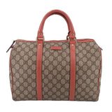 GUCCI Boston handle bag with tan GG canvas and rose leather trim, top zip closure.