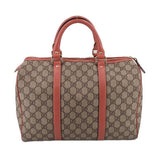 GUCCI Boston handle bag front view, tan GG canvas with rose center strap and top zip.
