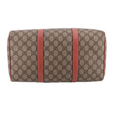 GUCCI Boston handle bag back view, tan GG canvas with two rose vertical leather straps.