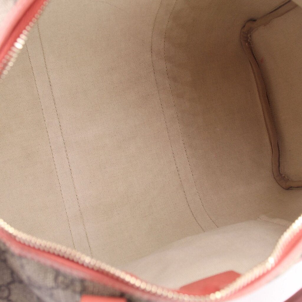 GUCCI Boston bag interior view, light canvas lining with inner side pocket opening.
