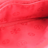 Red fabric lining with subtle TORY BURCH logo pattern