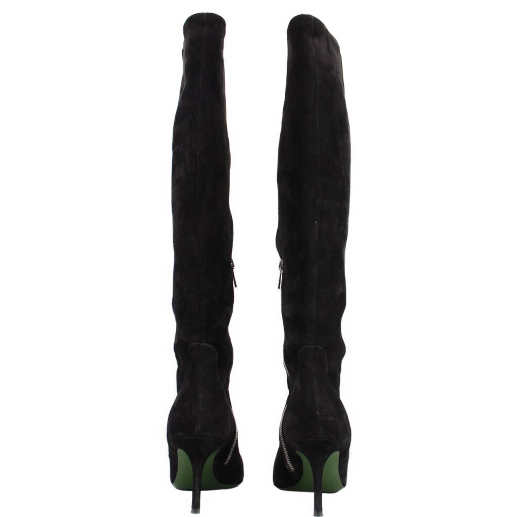 Back view of black knee-high heeled boots with green heel accents