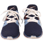 Navy mesh sneakers pair with white laces, light blue accents, and brown trim