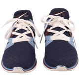 Navy mesh sneakers pair with white laces, light blue accents, and brown trim