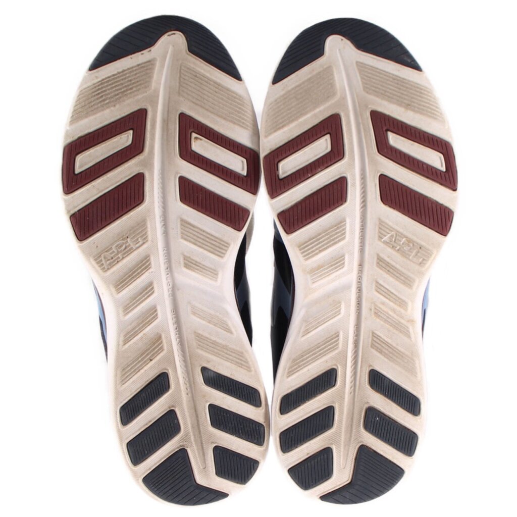 Shoe soles for navy mesh sneakers with textured traction and brown-red accents