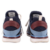 Navy mesh sneakers rear view with white laces, light blue heel panel, brown sole