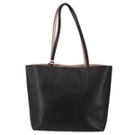 Black reversible tote bag with twin top handles and open top.