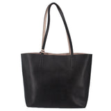 Black reversible tote bag with twin top handles and open top.