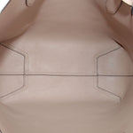 Beige interior lining of reversible tote bag with stitched panels.