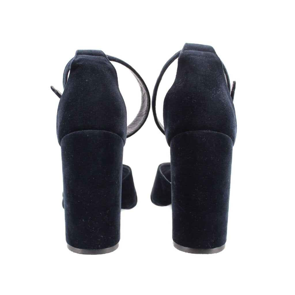 Back view of navy suede heeled sandals with ankle strap and block heel