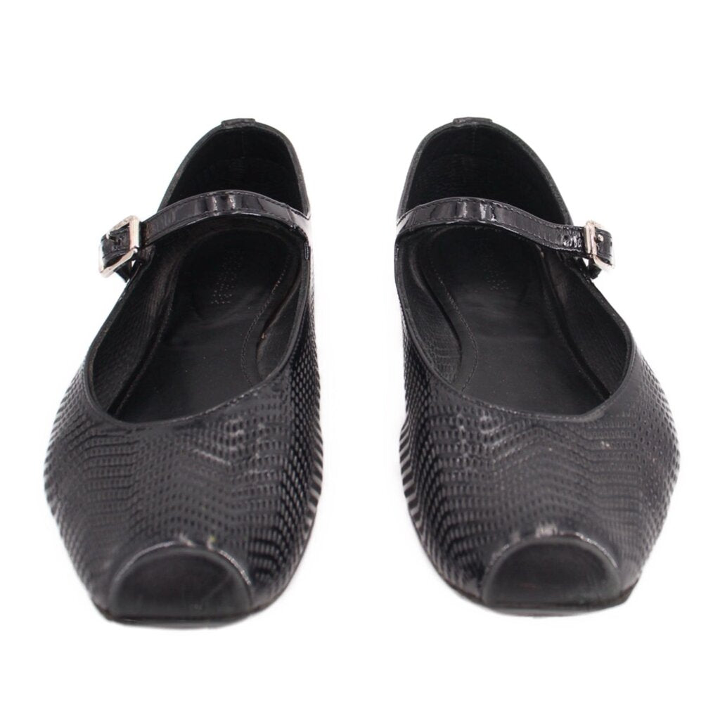 Black perforated flats with adjustable strap and open round toe