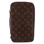 LOUIS VUITTON Voyage organizer wallet in brown monogram canvas with top zipper.