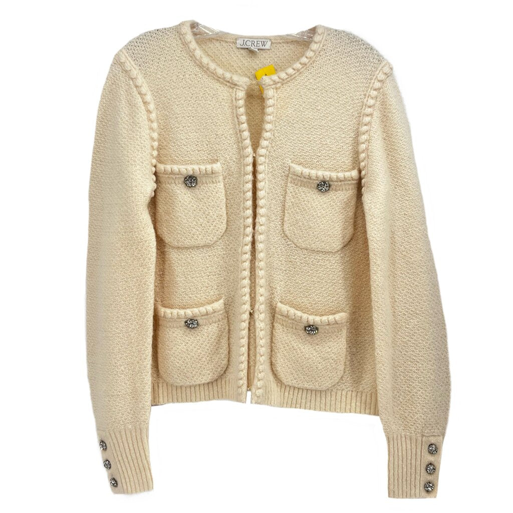 Cream knit jacket with front button placket, patch pockets, and decorative buttons