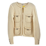 Cream knit jacket with front button placket, patch pockets, and decorative buttons