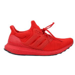 Red knit lace-up sneakers with adidas side stripes and black outsole.