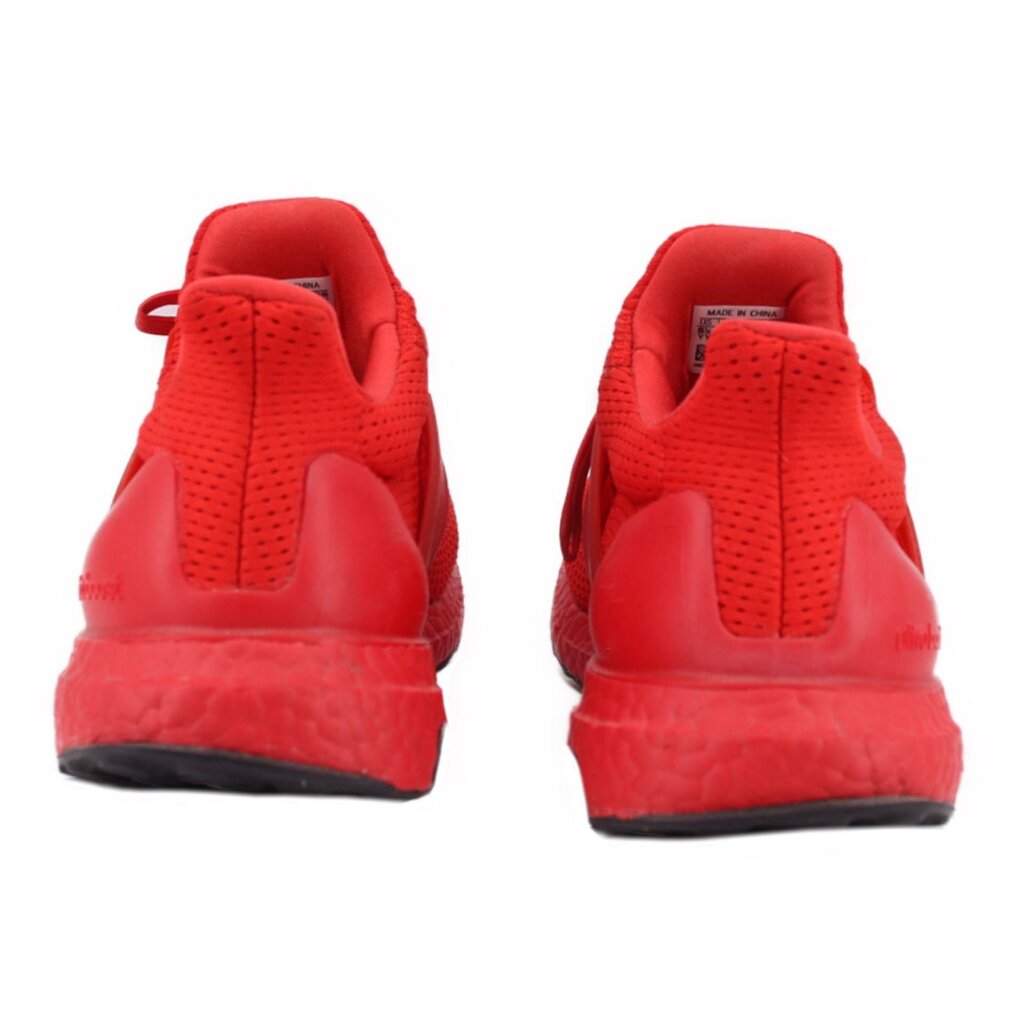 Red knit sneakers heel view with lace-up collar and black sole.