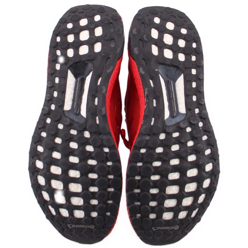 Red/black sneaker outsoles with raised grid traction pattern