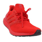 Red knit lace-up sneakers with adidas logo, side stripes, and black rubber sole.