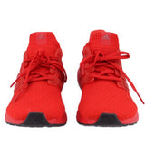 Red knit lace-up sneakers, front view with adidas logos and black outsole.