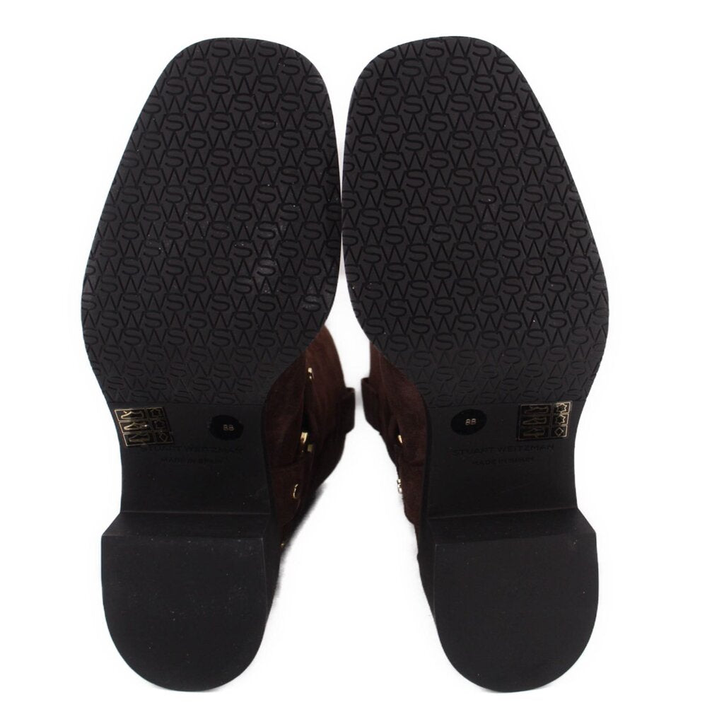 Brown suede boots with branded treaded outsole and logo pattern on heel
