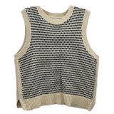 Cream and black sleeveless knit top with ribbed crew neck and hem