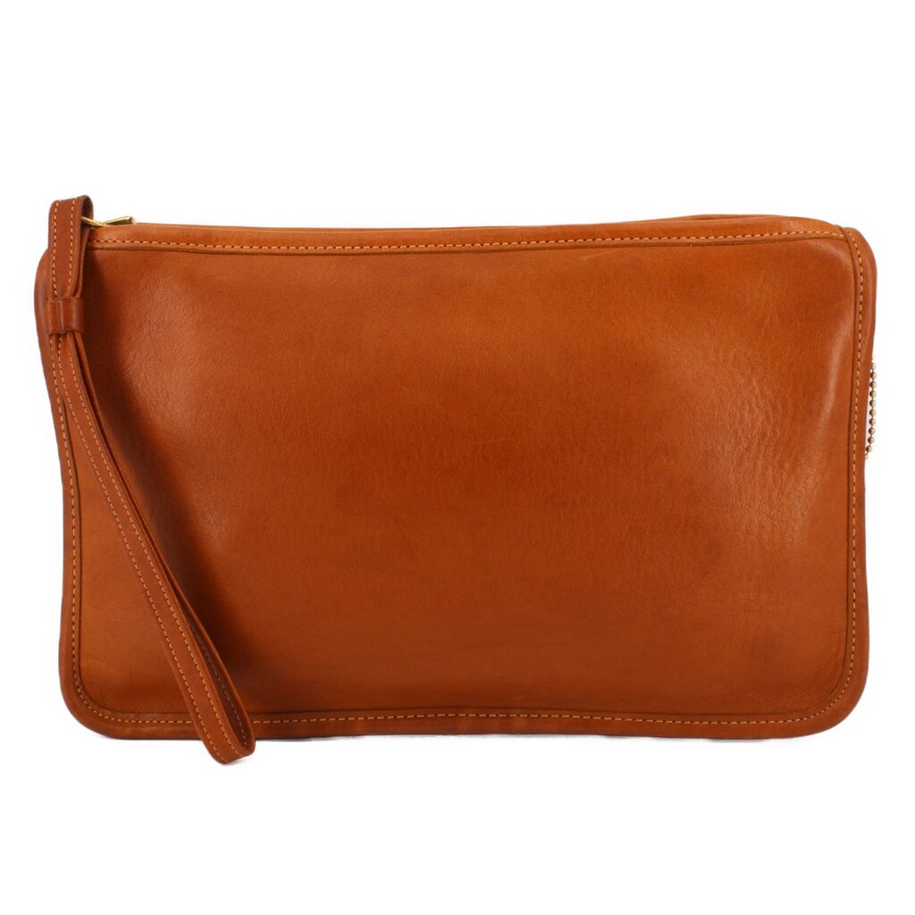 Tan leather clutch bag with wrist strap and top zipper, rounded corners.