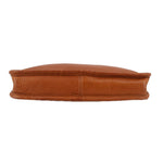 Tan leather clutch bag with structured base and top zipper edge, no strap shown.