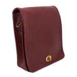 Oxblood leather compact pouch shoulder bag with flap and brass snap clasp