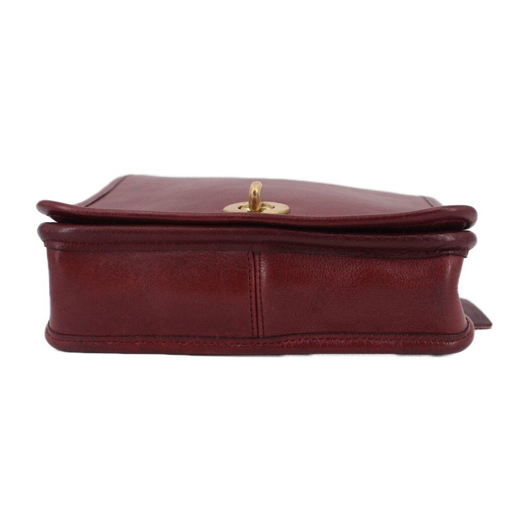 Oxblood leather compact pouch shoulder bag base with brass top clasp