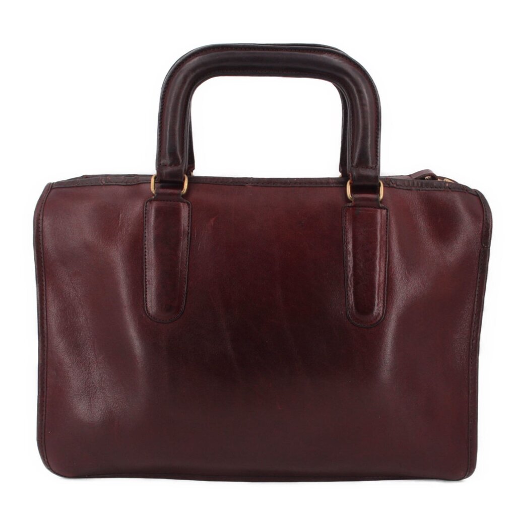 Oxblood slim leather satchel bag with two front handle straps and stitched trim
