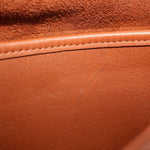 British tan leather interior panel with visible stitching seam and textured finish