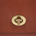 Turn-lock clasp on British tan flap with gold-tone hardware