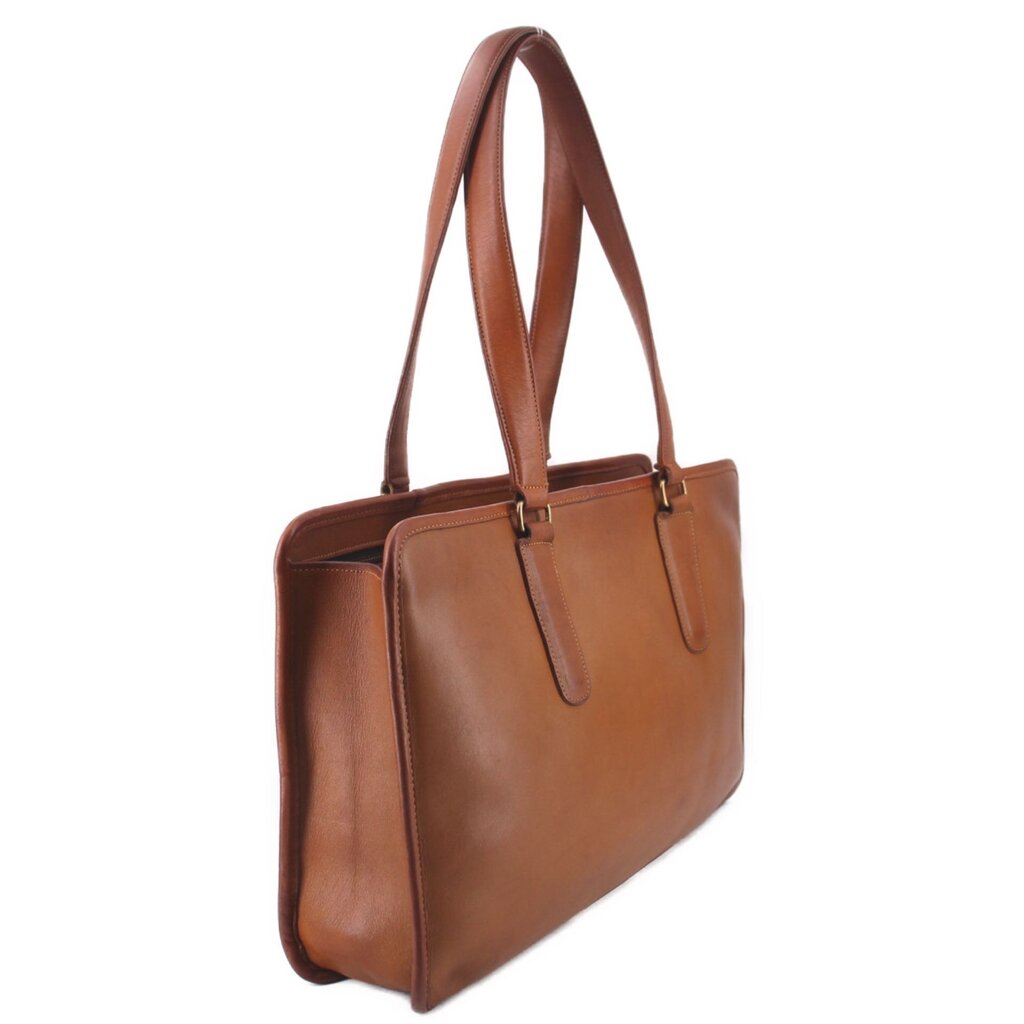 British tan leather tote bag shown at an angle with two top handles