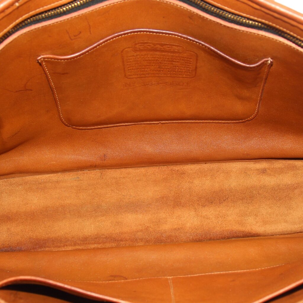 British tan leather tote interior with zipper opening and central leather pocket