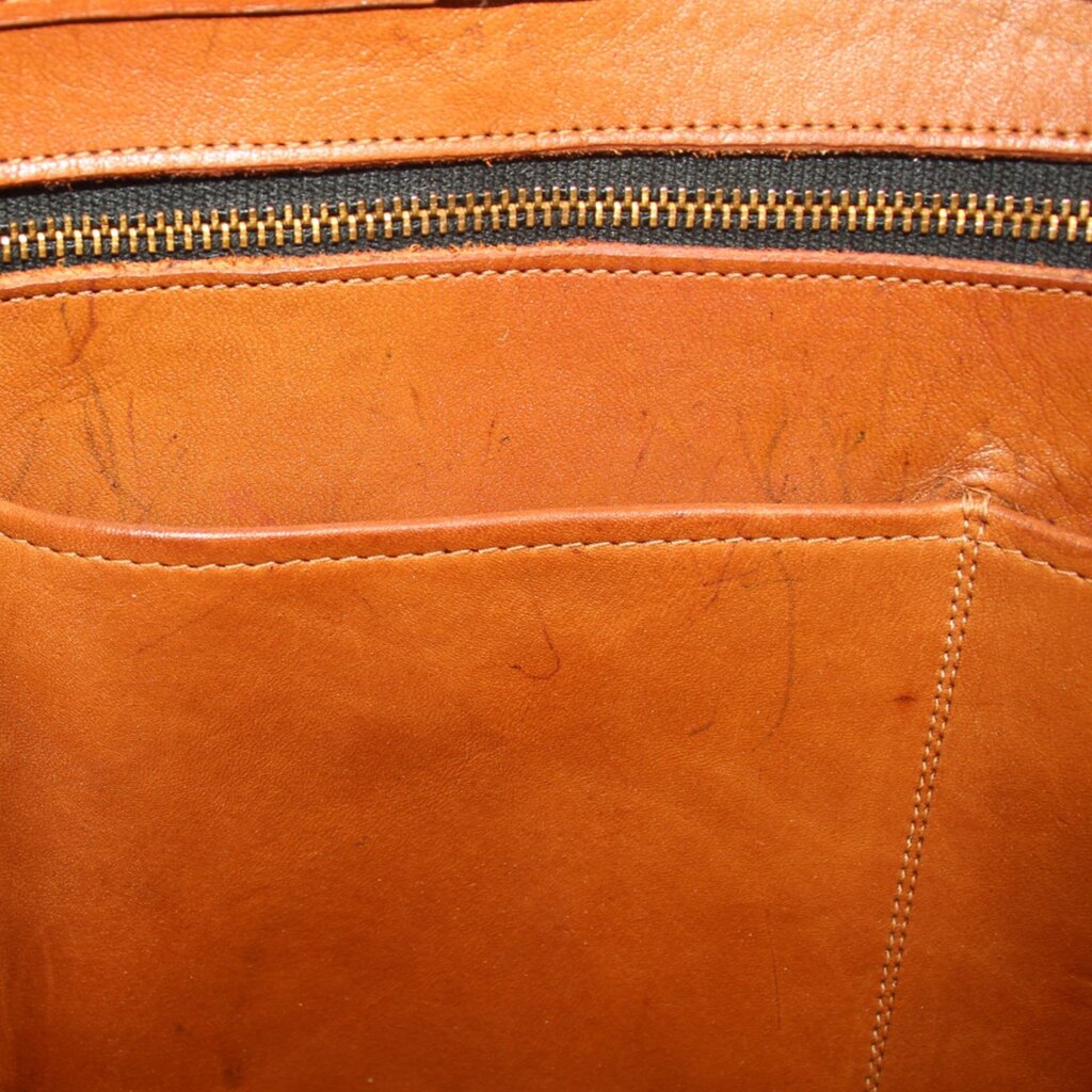Coach vintage marketing tote interior with zipper and tan leather stitching