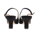Back view of black suede slingback heels with mid-height heel and ankle strap.