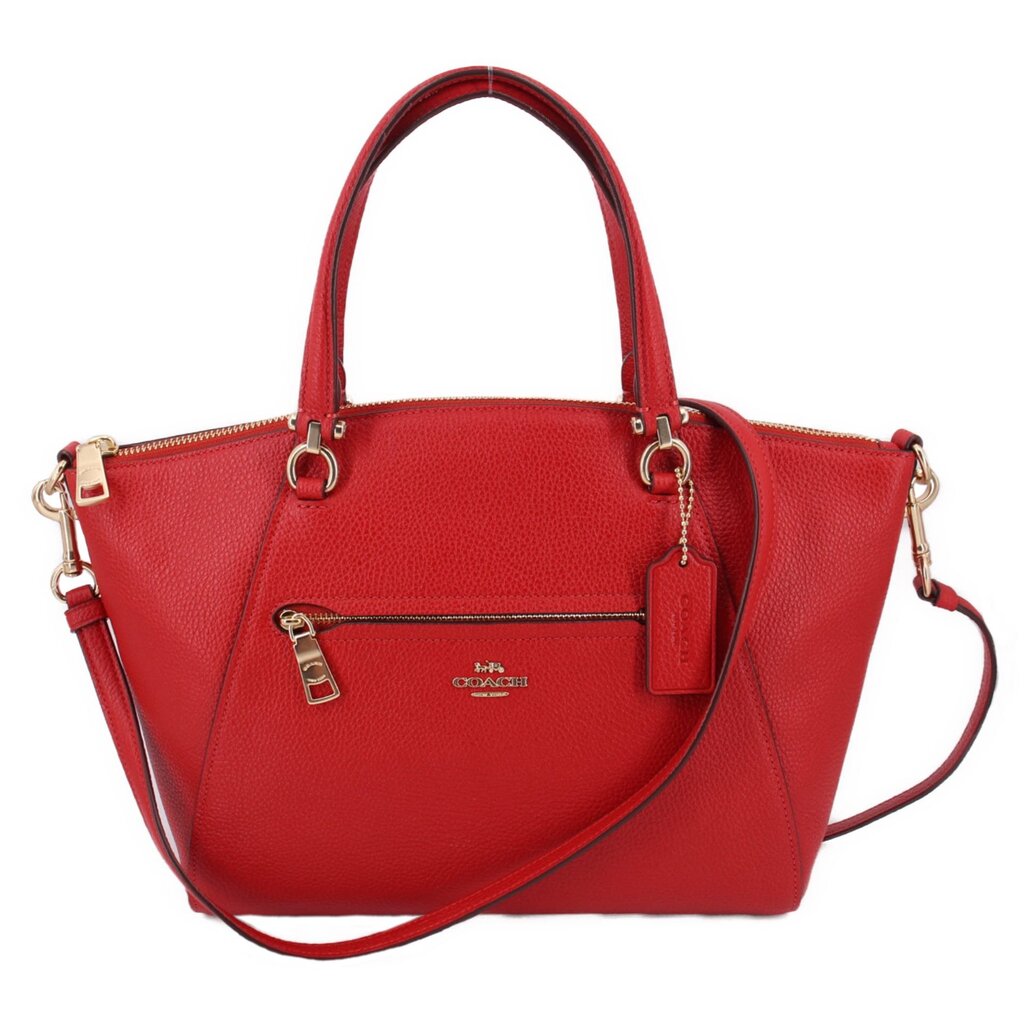 Red leather COACH Prairie satchel with dual handles and adjustable crossbody strap
