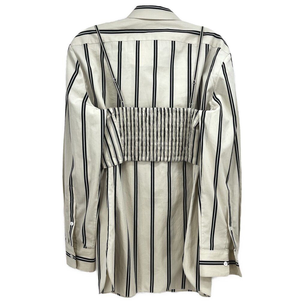 Back view of beige and black vertical striped top with collar and smocked panel