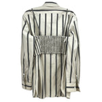 Back view of beige and black vertical striped top with collar and smocked panel