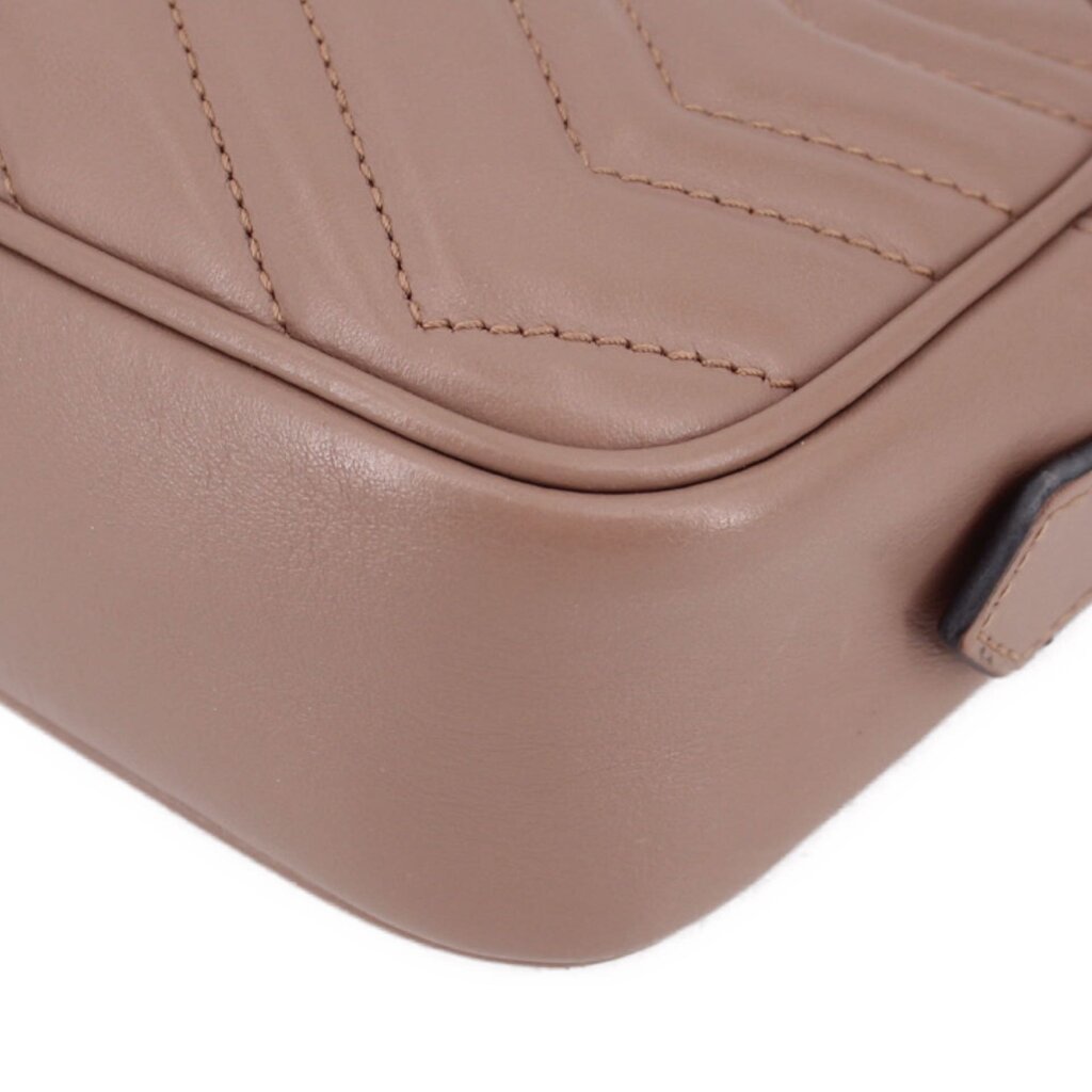 Taupe leather crossbody bag corner detail with stitched edging and zipper trim