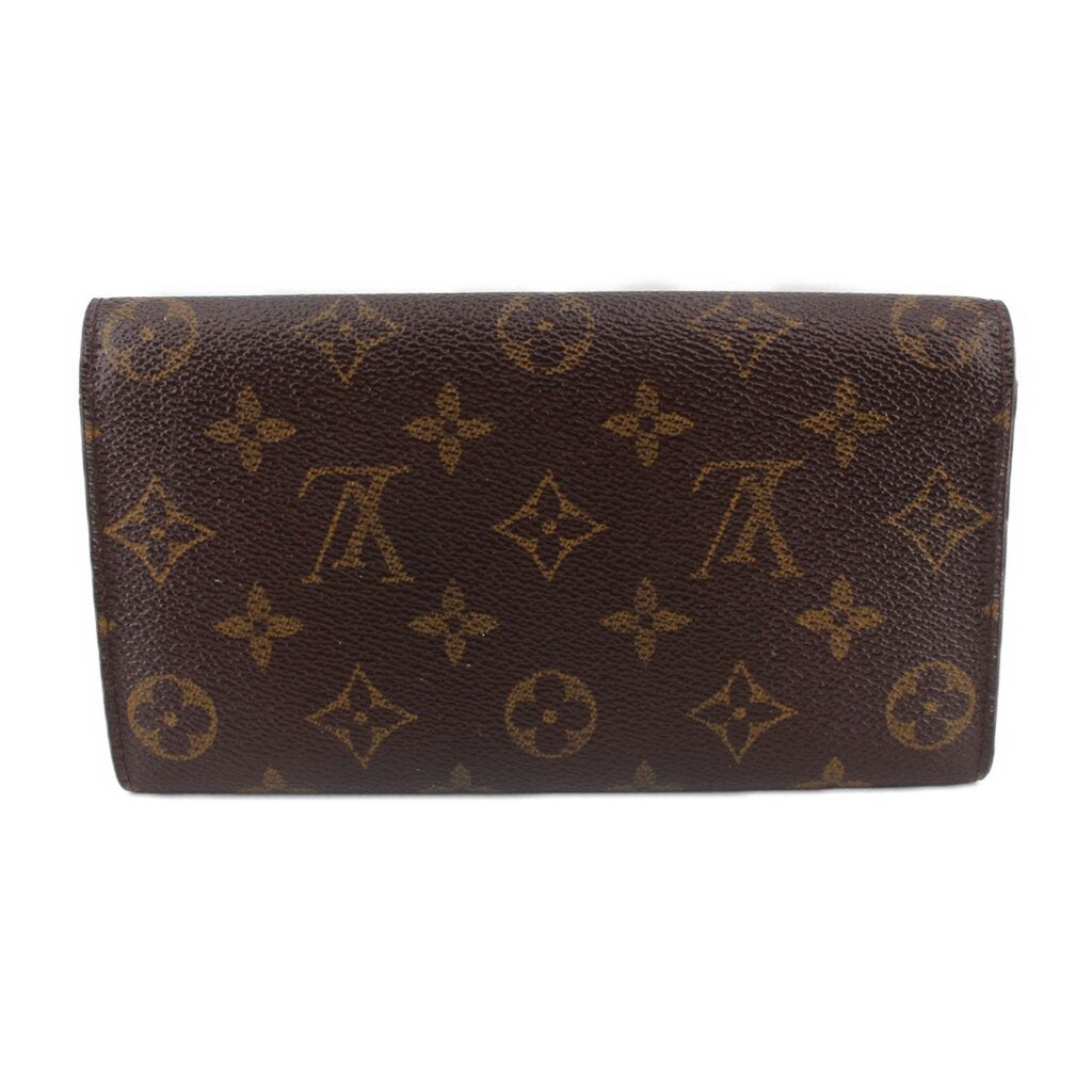 Monogram leather wallet with fold-over flap and smooth profile