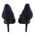 Back view of navy stiletto heels with curved heel and fabric upper