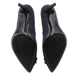 Navy high-heel shoes, underside view with textured black rubber sole