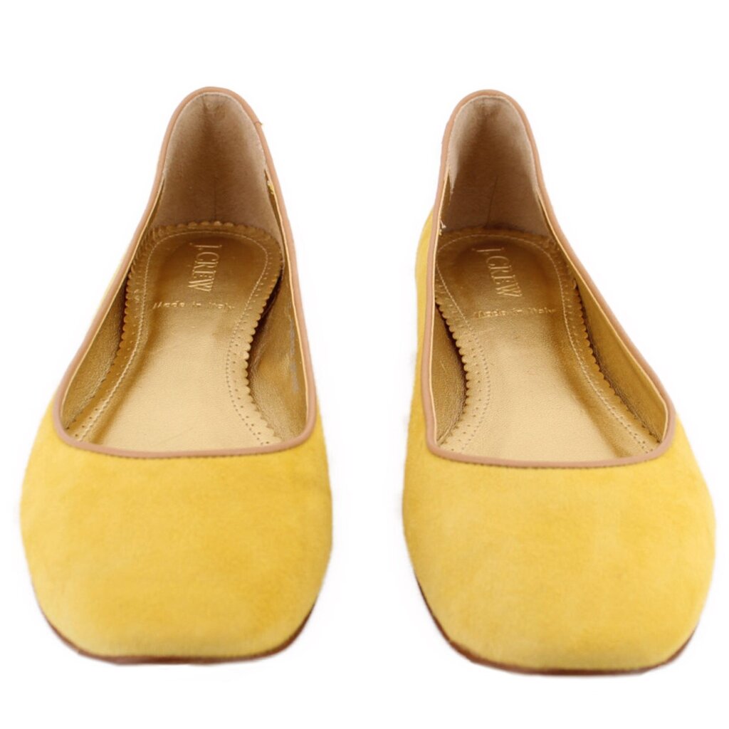 Yellow suede ballet flats, rounded interior opening and stitched topline