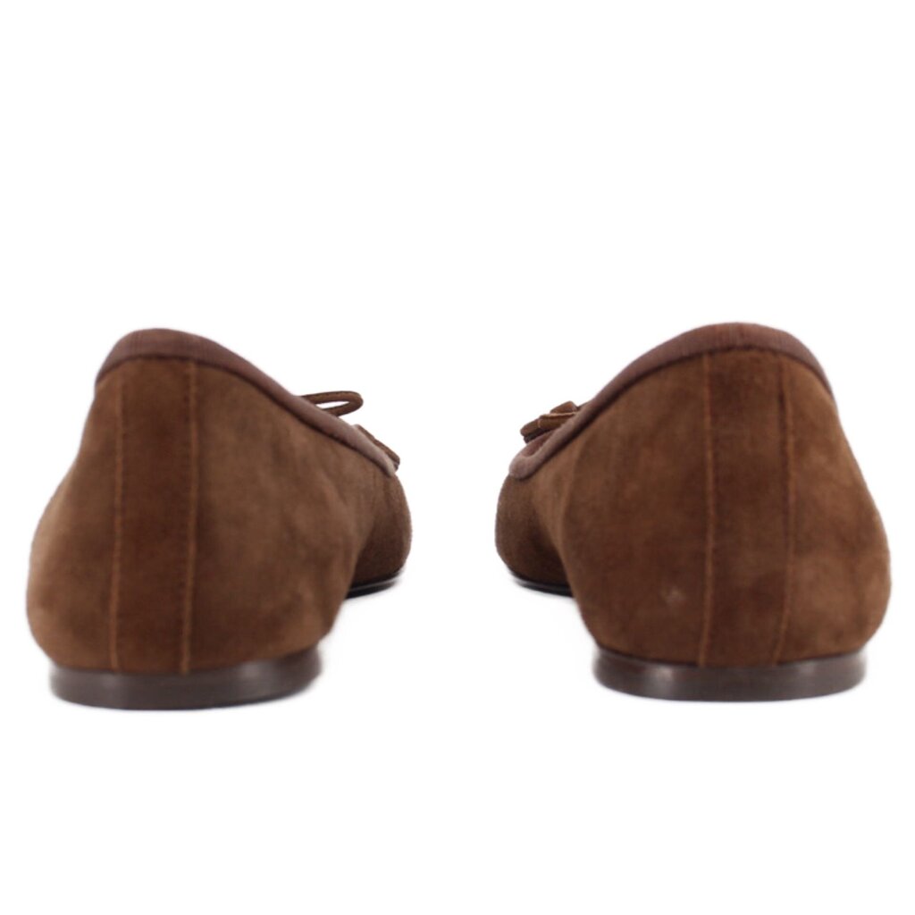 Brown suede ballet flats heel view with bow tie and low stacked sole